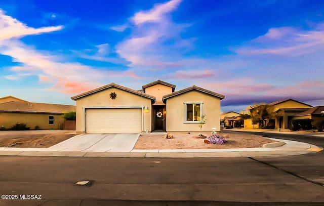 view of front of home with a garage