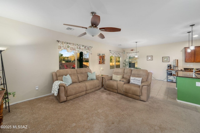 living room with light colored carpet and ceiling fan