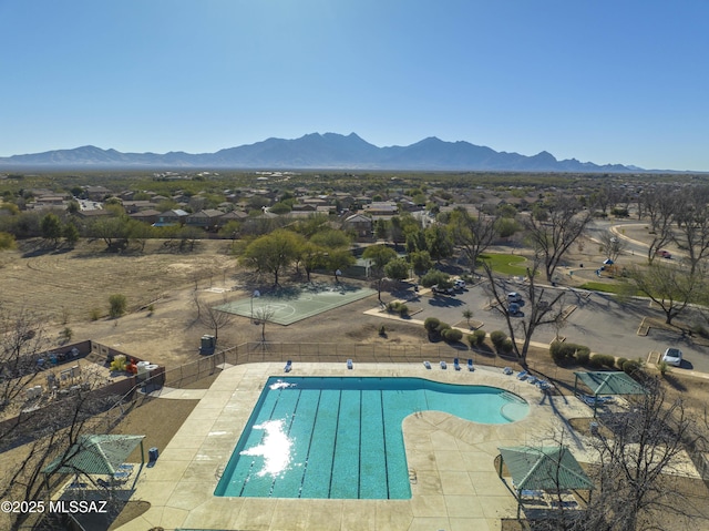 view of swimming pool featuring a mountain view