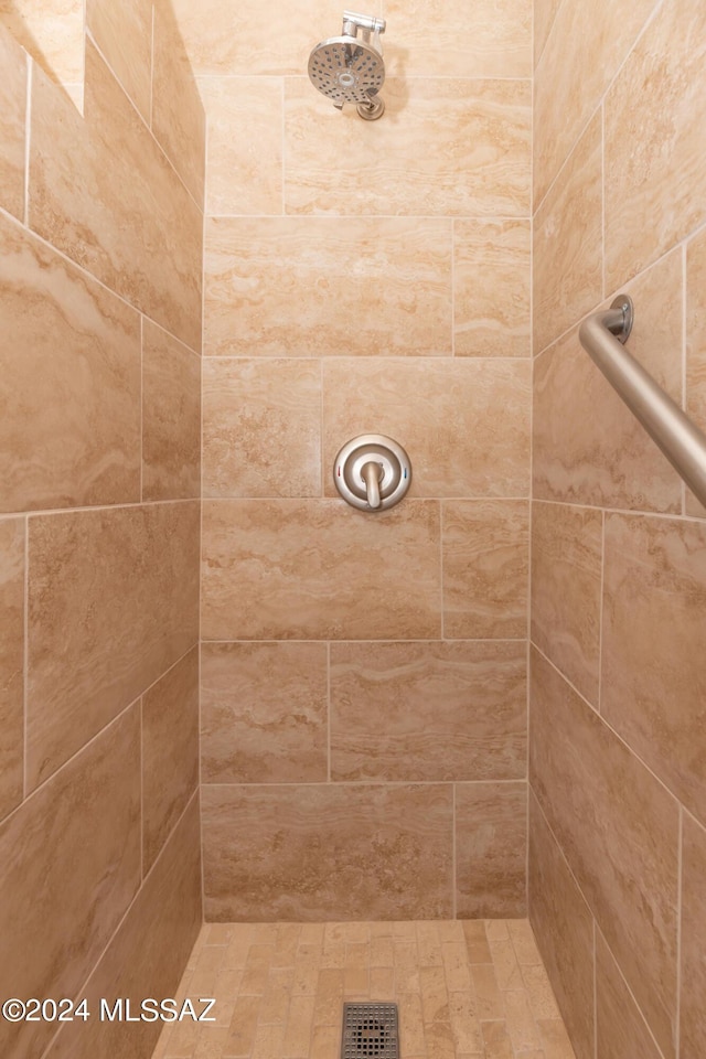 bathroom with tiled shower