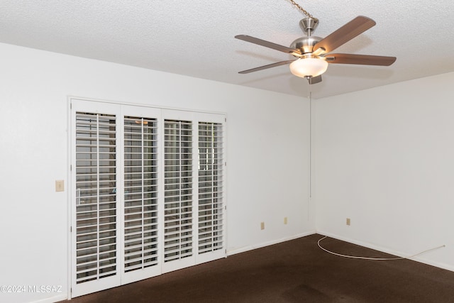 carpeted empty room with a textured ceiling and ceiling fan