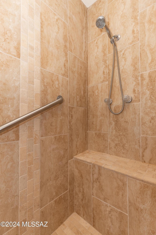 bathroom with tiled shower