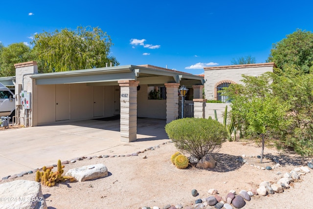 view of side of home with a carport