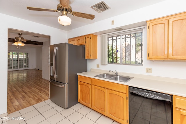 kitchen featuring ceiling fan, dishwasher, sink, stainless steel fridge, and light tile patterned flooring