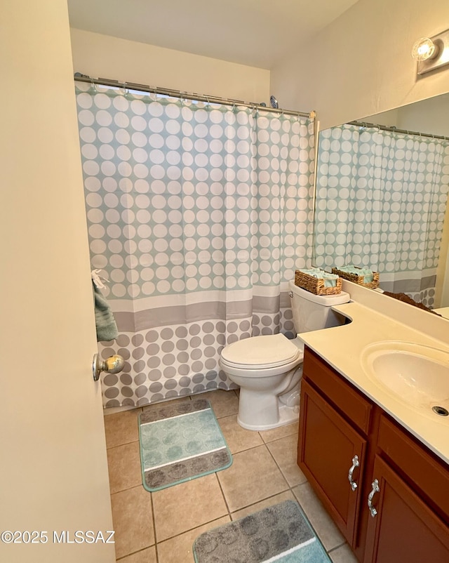 full bathroom with toilet, a shower with curtain, tile patterned flooring, and vanity