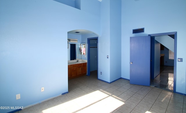 tiled spare room with sink