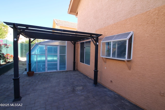 view of patio / terrace featuring fence and a pergola