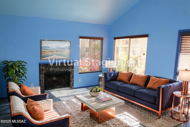 living room with a fireplace and vaulted ceiling