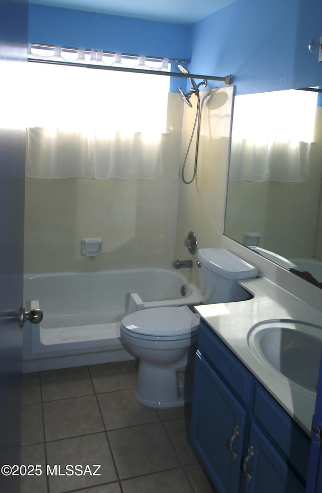 full bathroom featuring bathing tub / shower combination, tile patterned flooring, vanity, and toilet