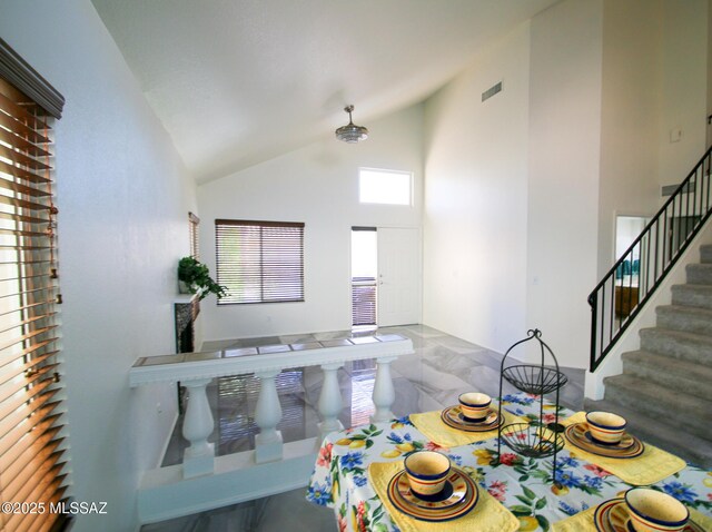 living room with vaulted ceiling and plenty of natural light