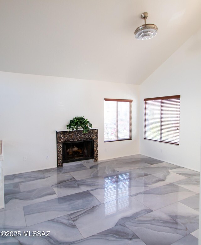 tiled dining room featuring vaulted ceiling