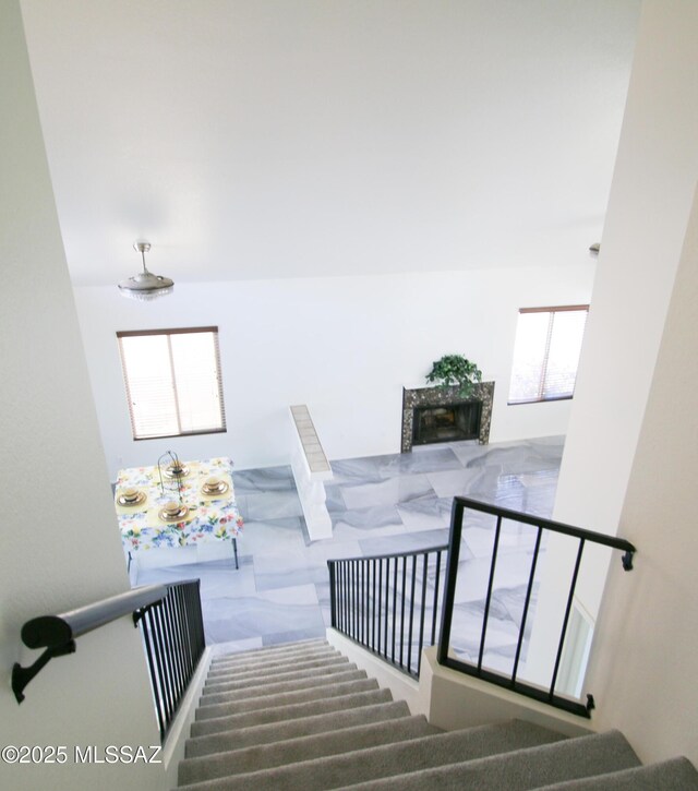 unfurnished living room featuring lofted ceiling