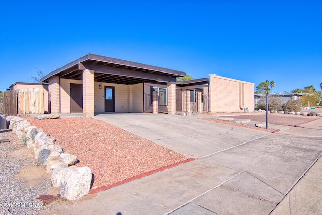 view of front facade with a carport