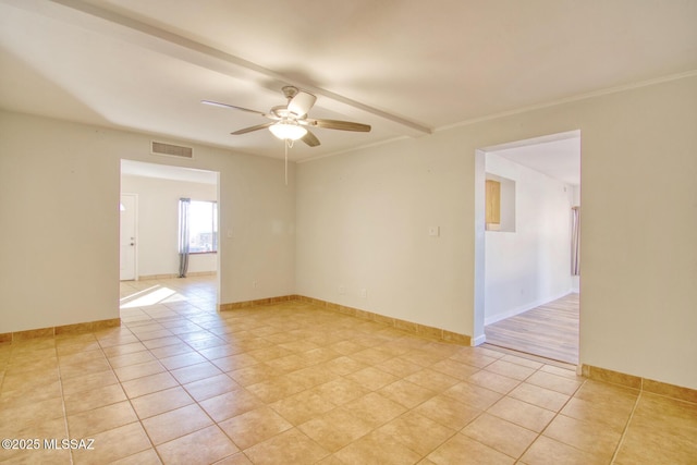 spare room with light tile patterned floors and ceiling fan