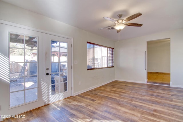 interior space with ceiling fan, light wood-type flooring, and french doors