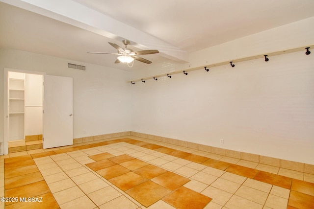 unfurnished room with ceiling fan and light tile patterned flooring