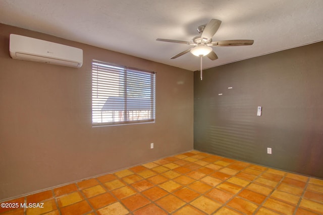 spare room featuring light tile patterned floors, a wall mounted AC, and ceiling fan