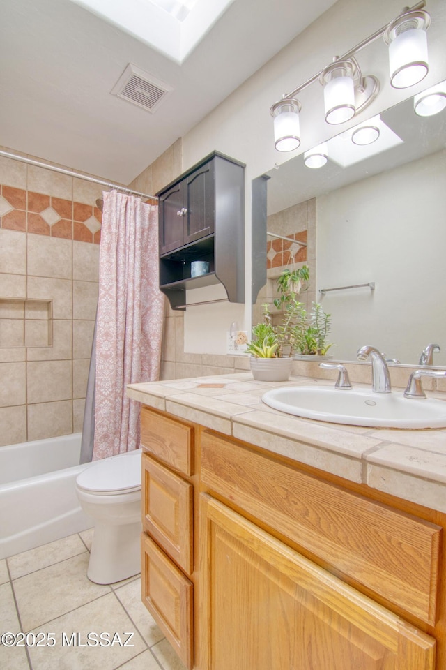 full bathroom with toilet, shower / tub combo, vanity, and tile patterned floors