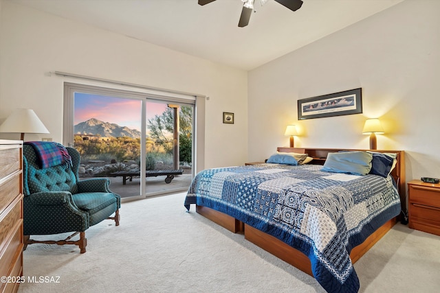 carpeted bedroom featuring ceiling fan and access to exterior