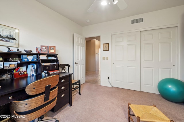 office with ceiling fan and light carpet