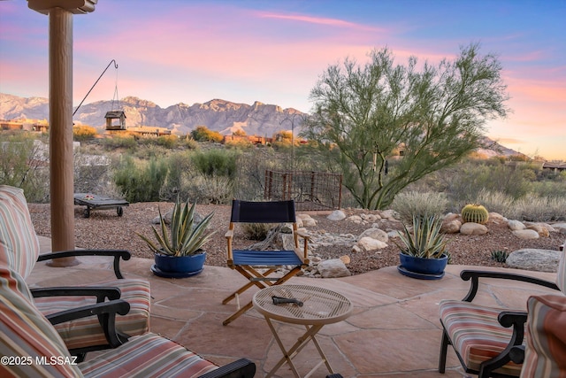 patio terrace at dusk with a mountain view