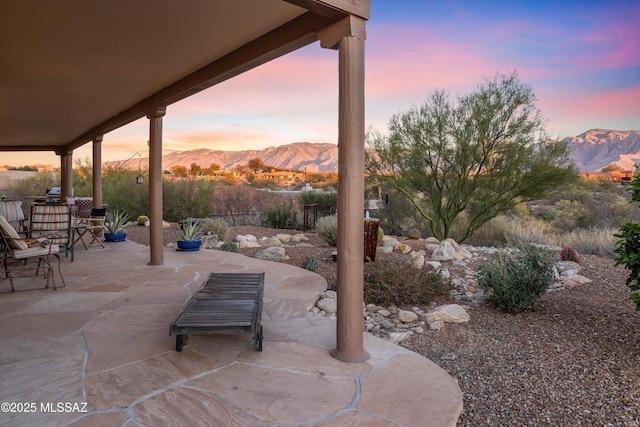 patio terrace at dusk with a mountain view