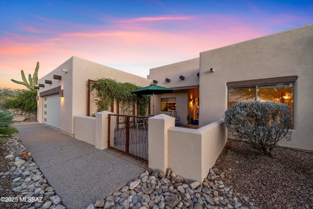 southwest-style home with a garage