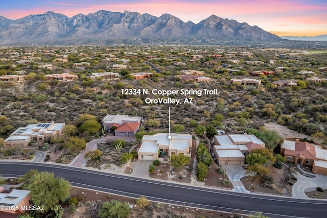 aerial view at dusk with a mountain view