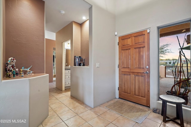 entryway featuring light tile patterned floors