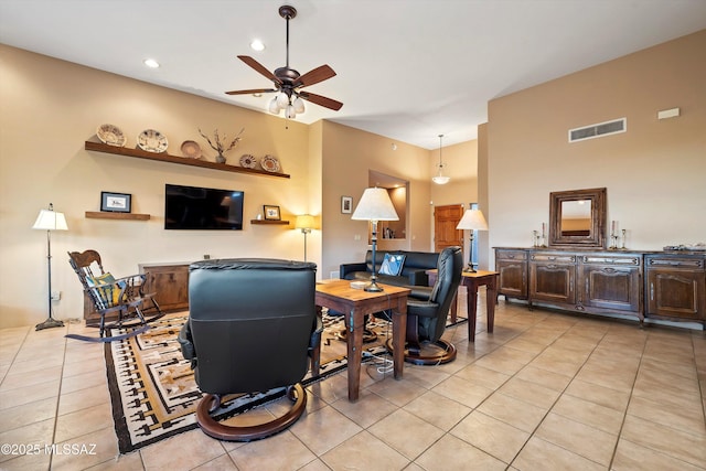 tiled living room featuring ceiling fan