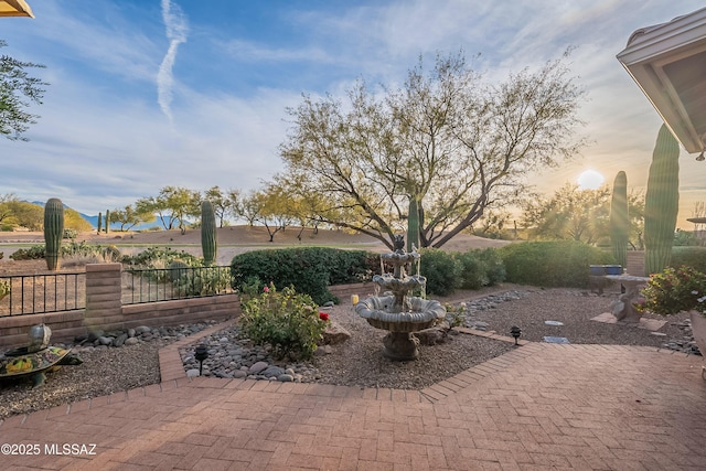 view of patio terrace at dusk