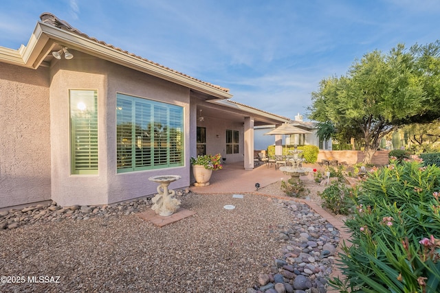 rear view of property with a patio area