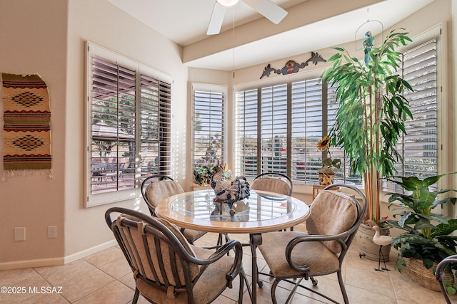 tiled dining area with ceiling fan