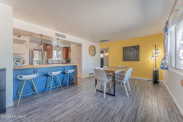 dining space with dark wood-type flooring