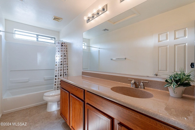 full bathroom with tile patterned floors, vanity, toilet, and shower / tub combo