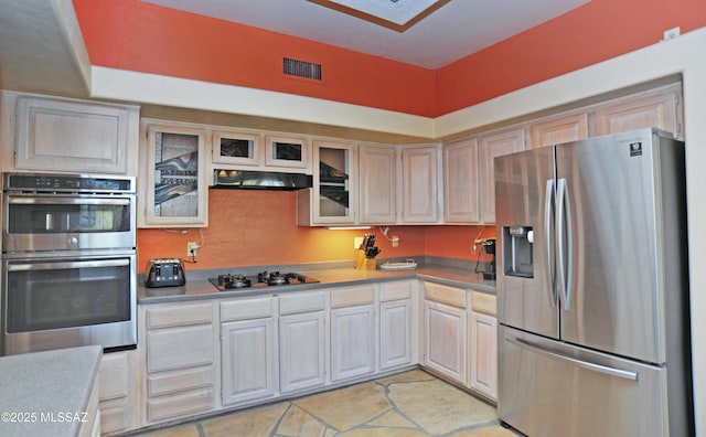 kitchen with appliances with stainless steel finishes and light tile patterned floors