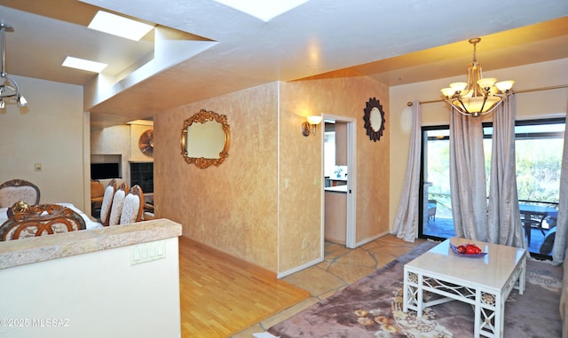 kitchen with a chandelier, light tile patterned floors, and decorative light fixtures