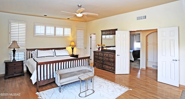 bedroom with hardwood / wood-style floors and ceiling fan