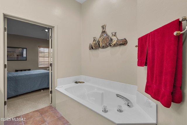 bathroom featuring tile patterned flooring and a tub