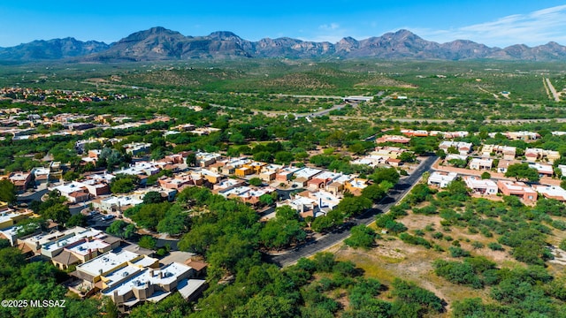 birds eye view of property with a mountain view