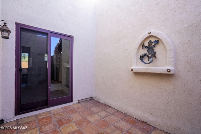 doorway to property featuring a patio area