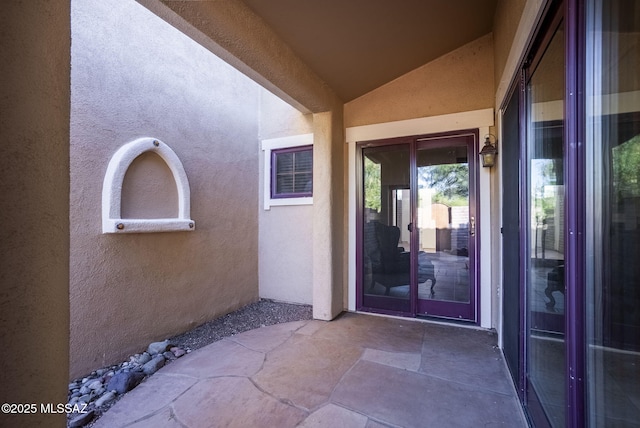 property entrance featuring a patio