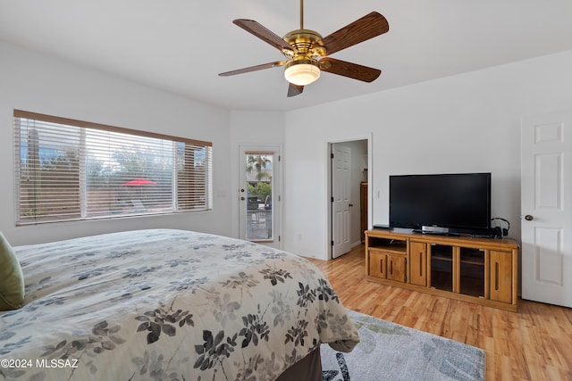 bedroom featuring access to outside, ceiling fan, and light wood-type flooring