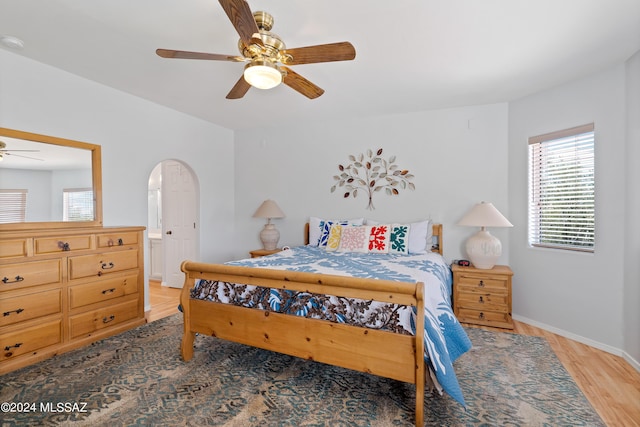 bedroom with wood-type flooring and ceiling fan