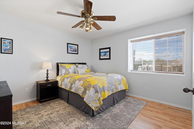 bedroom featuring ceiling fan and hardwood / wood-style flooring