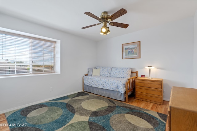 bedroom featuring hardwood / wood-style floors and ceiling fan