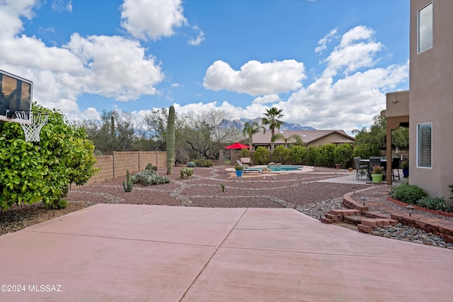 view of patio with a fenced in pool