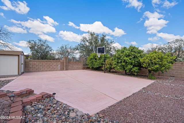 view of patio with a shed