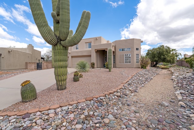 adobe home featuring a garage