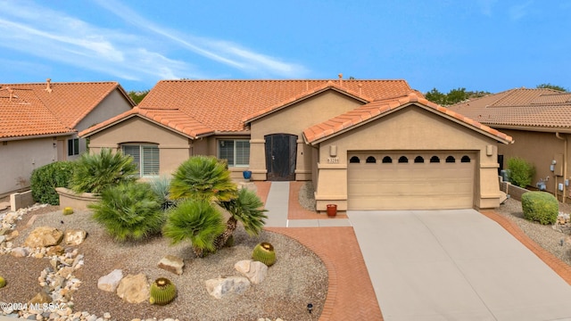 view of front of property featuring a garage